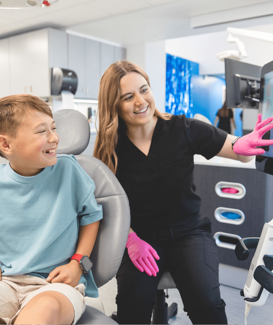 Young patient and team member smiling during visit